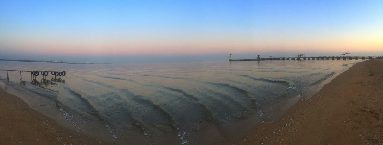 sea, beach, water, horizon over water, tranquil scene, scenics, shore, sunset, sand, tranquility, beauty in nature, nature, copy space, sky, clear sky, idyllic, wave, incidental people, pier, coastline