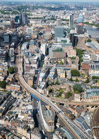 High angle view of cars on street amidst buildings in city