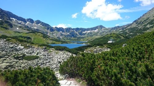 Scenic view of lake and mountains against sky