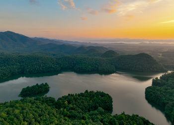 Scenic view of lake against sky during sunset