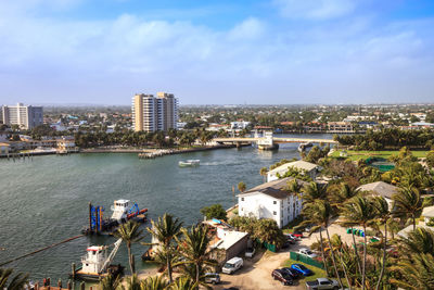 High angle view of buildings and sea against sky