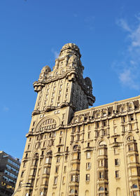 Low angle view of building against blue sky