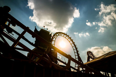 Low angle view of ferris wheel against sky