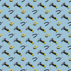 Hammers, pliers, and duct tape on a gray background, pattern, hard shadows. construction tools