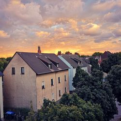 Buildings against sky during sunset