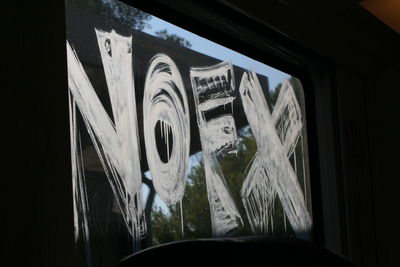 Low angle view of graffiti on car window