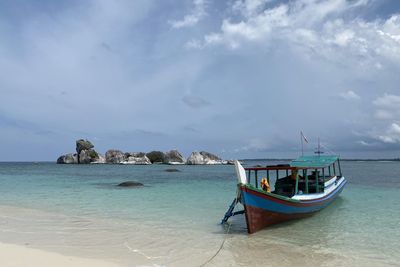 Boat in sea against sky