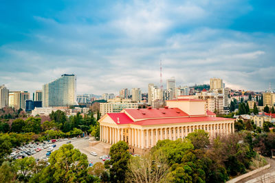 High angle view of buildings in city against sky