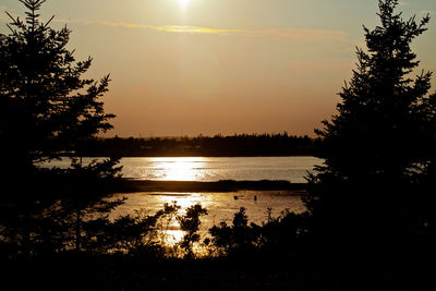 Scenic view of sunset over lake