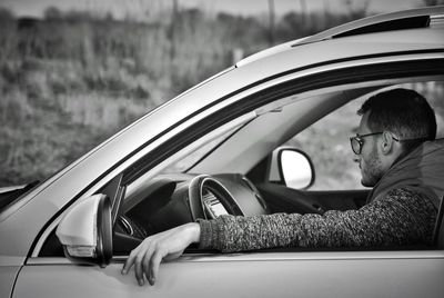 Portrait of man in car