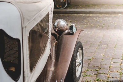 Close-up of car on road