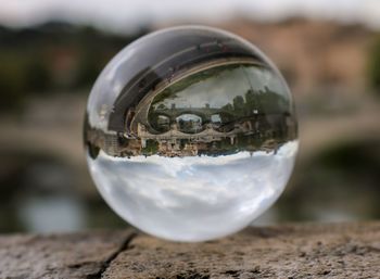 Close-up of crystal ball on glass