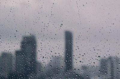 Full frame shot of wet glass window during rainy season