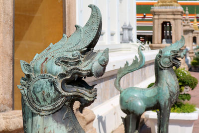 Amazing bronze sculptures of singha, a mythological lion at  wat pho, bangkok, thailand