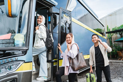 Low angle view of man standing in bus