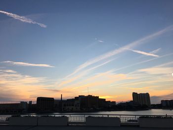 Cityscape against sky during sunset