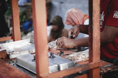 Man working on metal grate
