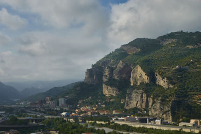 Buildings in town against sky