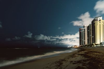 Scenic view of beach against sky at night