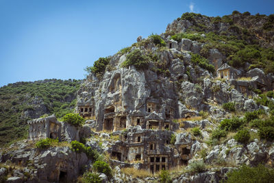 Built structure on mountain against sky