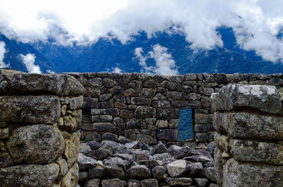 View of old ruin building against cloudy sky