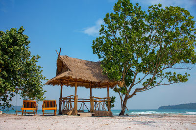 Built structure on beach against sky