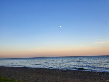 Scenic view of sea against sky at sunset