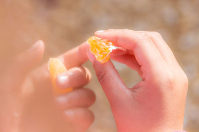 Close-up of woman holding hands