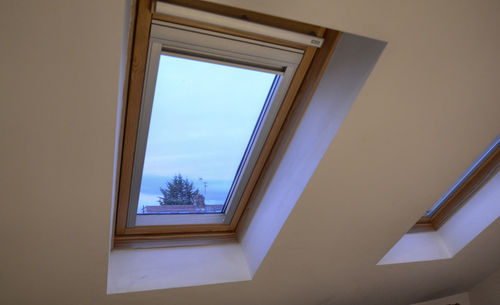 Low angle view of skylight in building