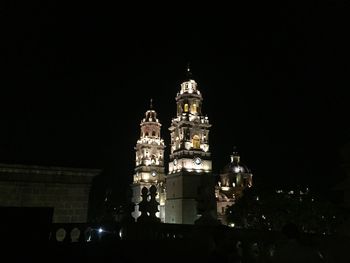 Low angle view of illuminated temple against sky at night