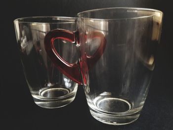 Close-up of wineglass against black background