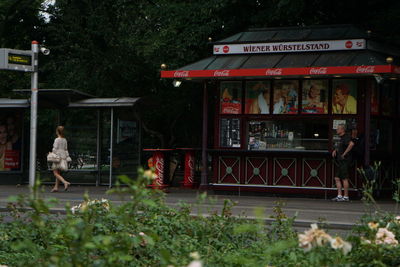 People sitting in front of store