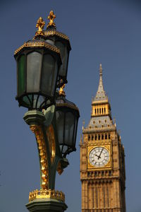 Low angle view of clock tower against sky