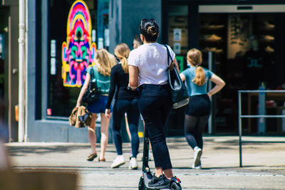 People walking on street in city