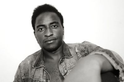 Portrait of young man against white background