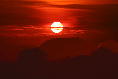 Silhouette rock against sky during sunset