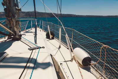 Boat sailing in sea on sunny day