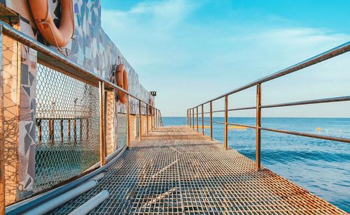 Low angle view of woman on beach against sky