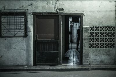 Man on door of building