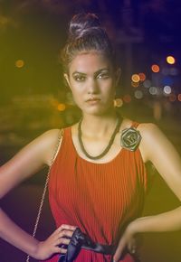 Portrait of beautiful young woman standing outdoors