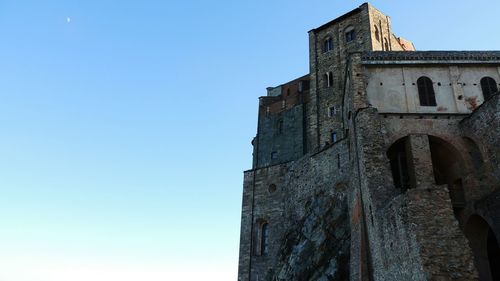 Low angle view of built structure against blue sky