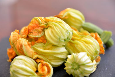 Close-up of orange flowers on table