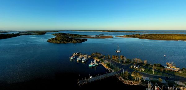Scenic view of sea against clear blue sky