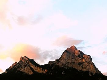 Low angle view of rock formation against sky