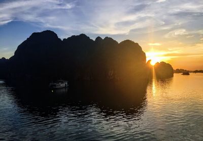 Scenic view of silhouette mountain against sky during sunset