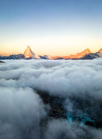 Sunrise at matterhorn, mountain above the clouds. swiss alps.