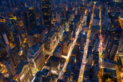 Aerial view of buildings in city at night