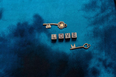 High angle view of stuffed toy against blue background