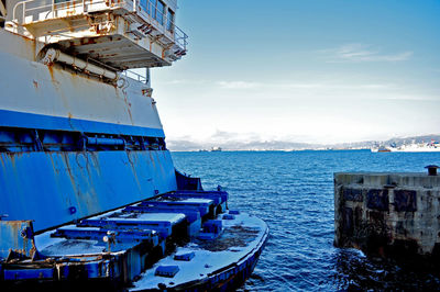 View of built structure by sea