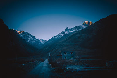 Scenic view of snowcapped mountains against clear sky